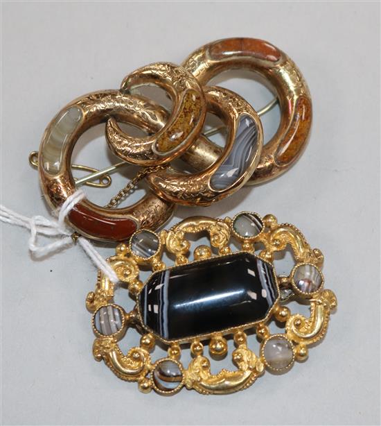 Two gold and agate brooches.